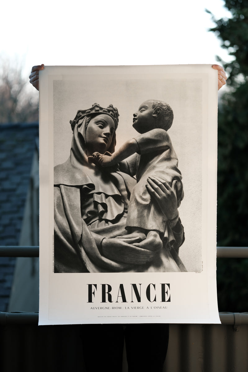 Travel Poster: "La Vierge a L'oiseau" or the Virgin and the Bird, which is actually a woman and child, in Riom, France.